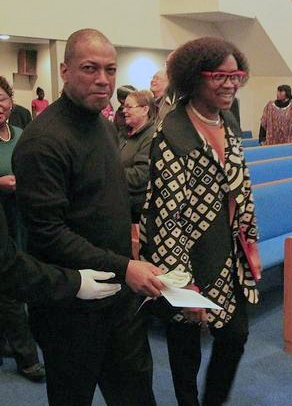 Rev. Michael Walker walks Rev. Irene Monroe in the procession to the the Martin Luther King Jr. Commemoration.